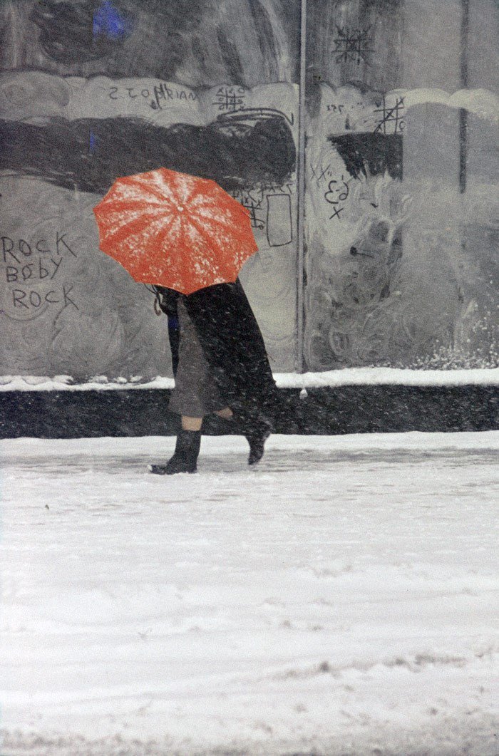 And let's pause with a classicSaul Leiter, Red umbrella, 1958