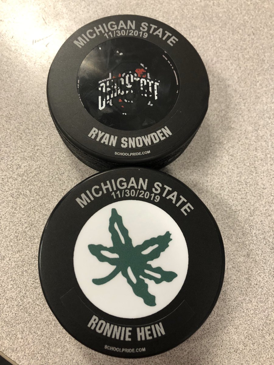 OhioStateMHKY's tweet photo. After the 3-1 win over the Spartans:

⚫️ Game puck to Ryan Snowden (26 saves in first collegiate start)
🎩 Hard hat to Ronnie Hein (2 goals/2 blocks/+2)

#GoBucks https://t.co/qIze2iAsAc