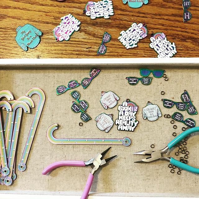Landfallfreight's tweet photo. It’s a busy day here at Rainbow Punch Press! Assembling gorgeous rainbow bookmarks and keychains today! Just waiting on our packaging and our pins and patches and we can start shipping our Kickstarter rewards!!! .
.
.
.
.
.
.
.
#bookmarks #booknerdigans … https://t.co/3FAhKijGpX https://t.co/74PXmWXYnV
