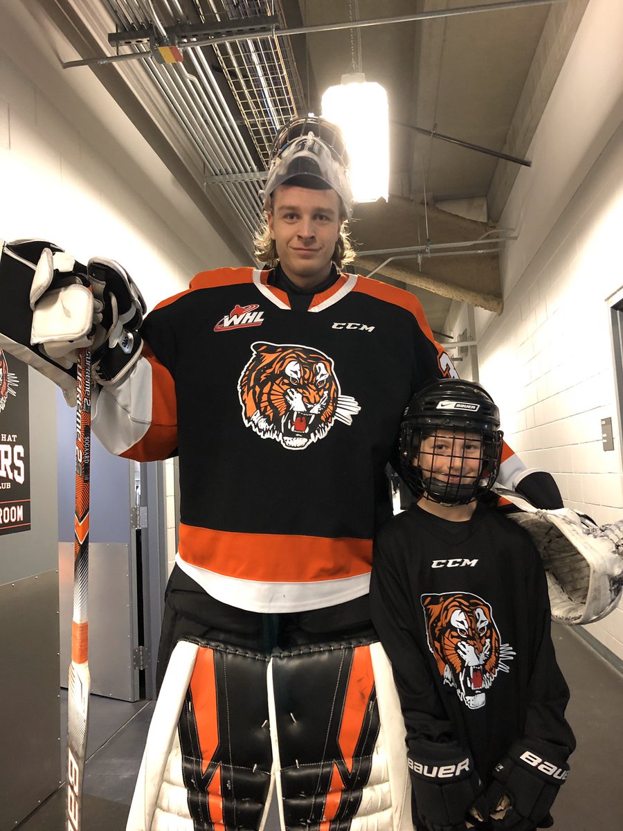 tigershockey's tweet photo. Our @MedicineHatNews Junior Tiger, Zion, with his favourite Tiger Mads!!

#medhat #50yearsofTigers #MHvsSAS https://t.co/4aKFaygT6C