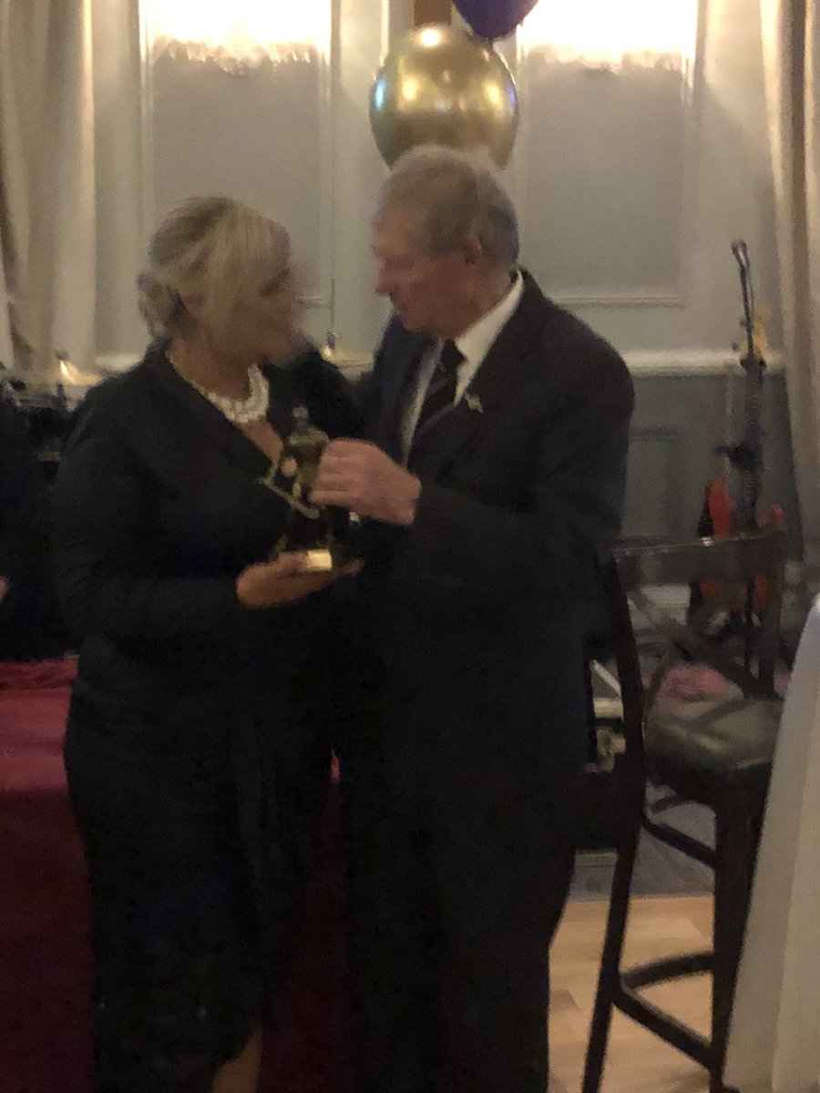 faytheharriers's tweet photo. At our 70th Anniversary the club took time to remember the late Mikey Sheil who was involved with this bunch of lads from an early age to his untimely death. Our Guest of Honour Mícheál Ó Muircheartaigh makes a presentation to Mikey’s wife Mareva Shiel to remember Mikey’s legacy. https://t.co/wzDBSnw5xH