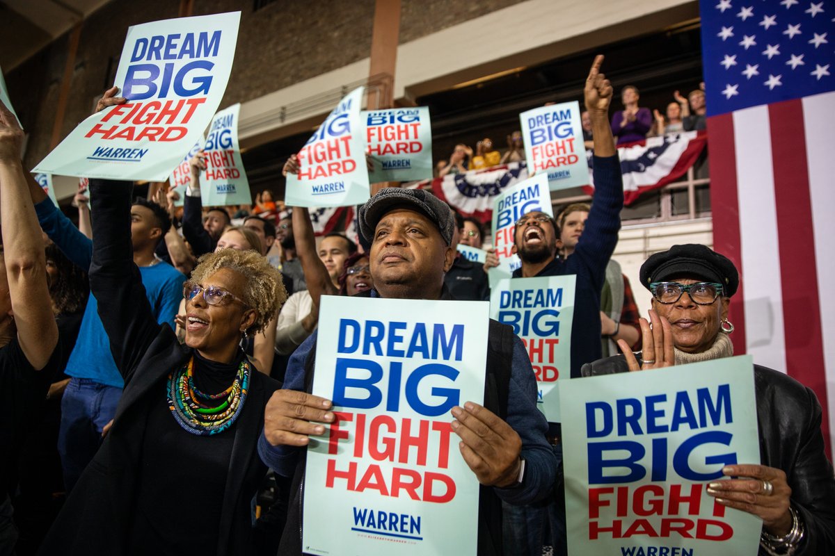 The crowd cheers at the Chicago town hall.