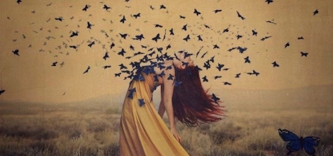 woman with butterflies flying out of her chest