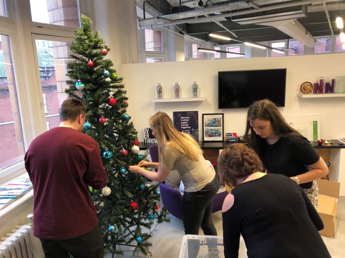 ThatSmartPerson's tweet photo. Things are feeling festive! The #PHDManchester Christmas tree is going up just in time to put some of our latest toy donations for @WoodSt_Mission under it. https://t.co/i853WrBHoO