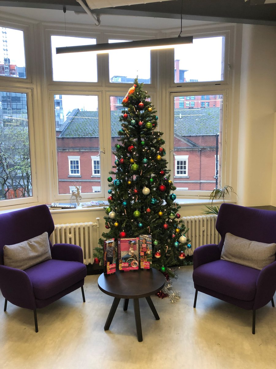 ThatSmartPerson's tweet photo. Things are feeling festive! The #PHDManchester Christmas tree is going up just in time to put some of our latest toy donations for @WoodSt_Mission under it. https://t.co/i853WrBHoO