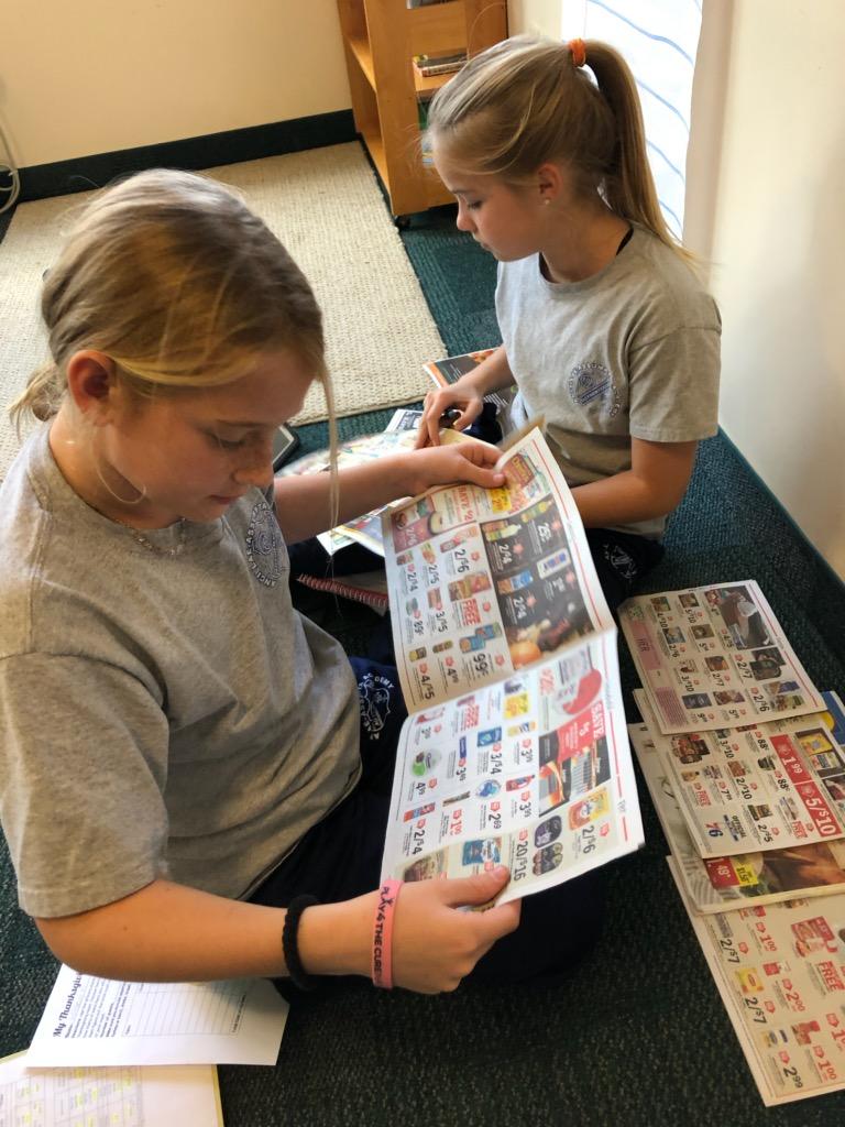 ancillaemath's tweet photo. @AncillaeAssumpt Fifth graders practiced adding decimals by using food circulars to plan their Thanksgiving feast. https://t.co/12JK1Tk6QS