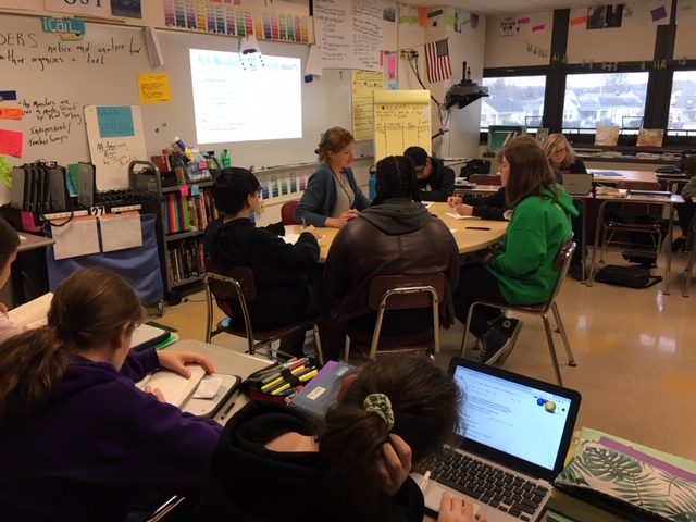 Lauren Sullivan in action with small groups at Garfield.  Students are highly engaged and room is filled with literacy learning!