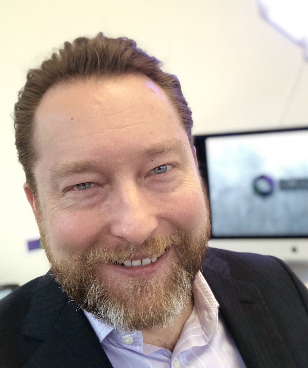 Zach after the completion of no shave November, with a full beard.