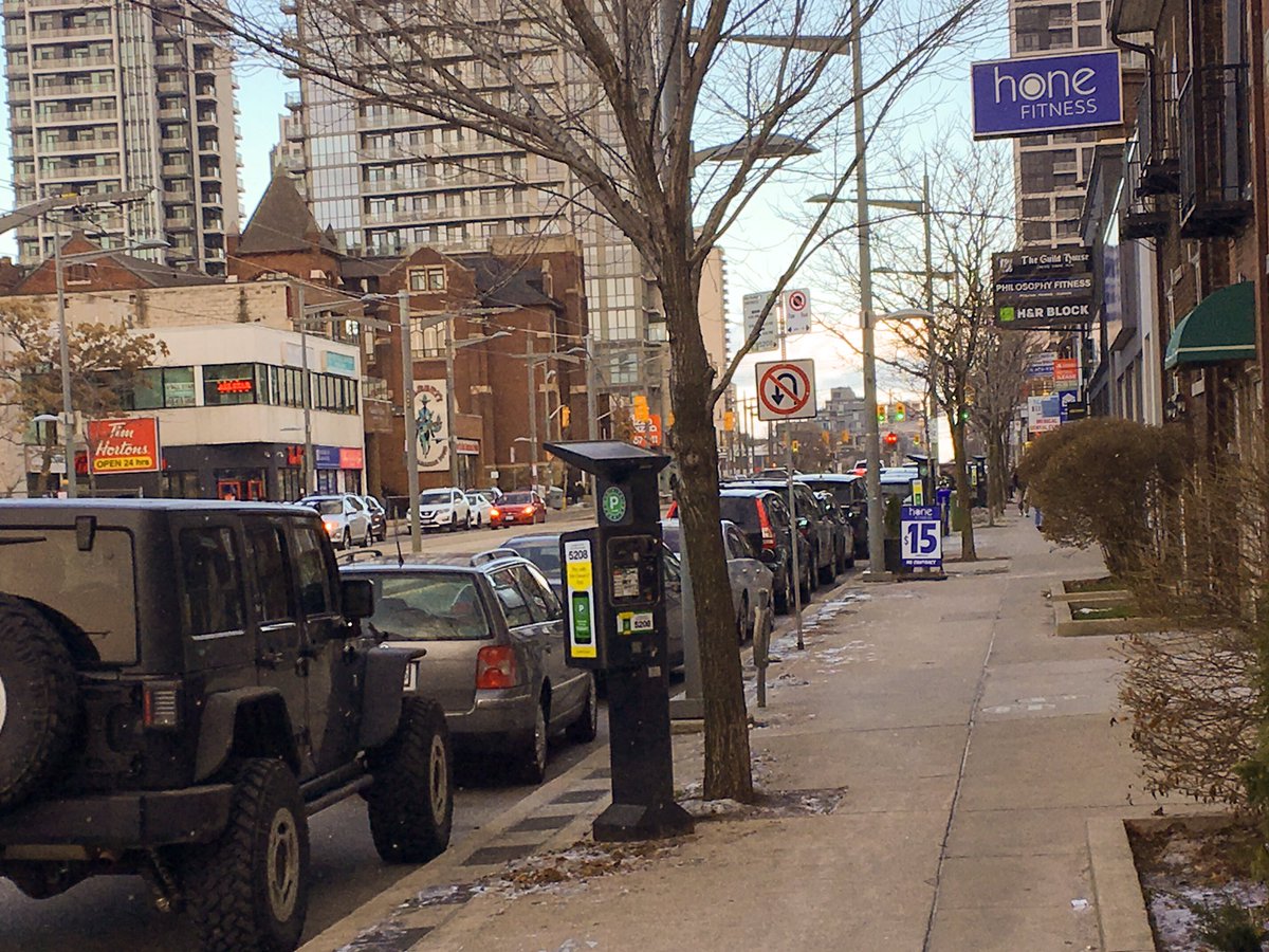 g_meslin's tweet photo. Almost every spot along the street is occupied. If the City is looking for low-hanging revenue opportunities, it could start with paid parking exclusions that are a throwback to a past when Sunday morning meant closed shops and empty streets. https://t.co/sMnlYha9YX