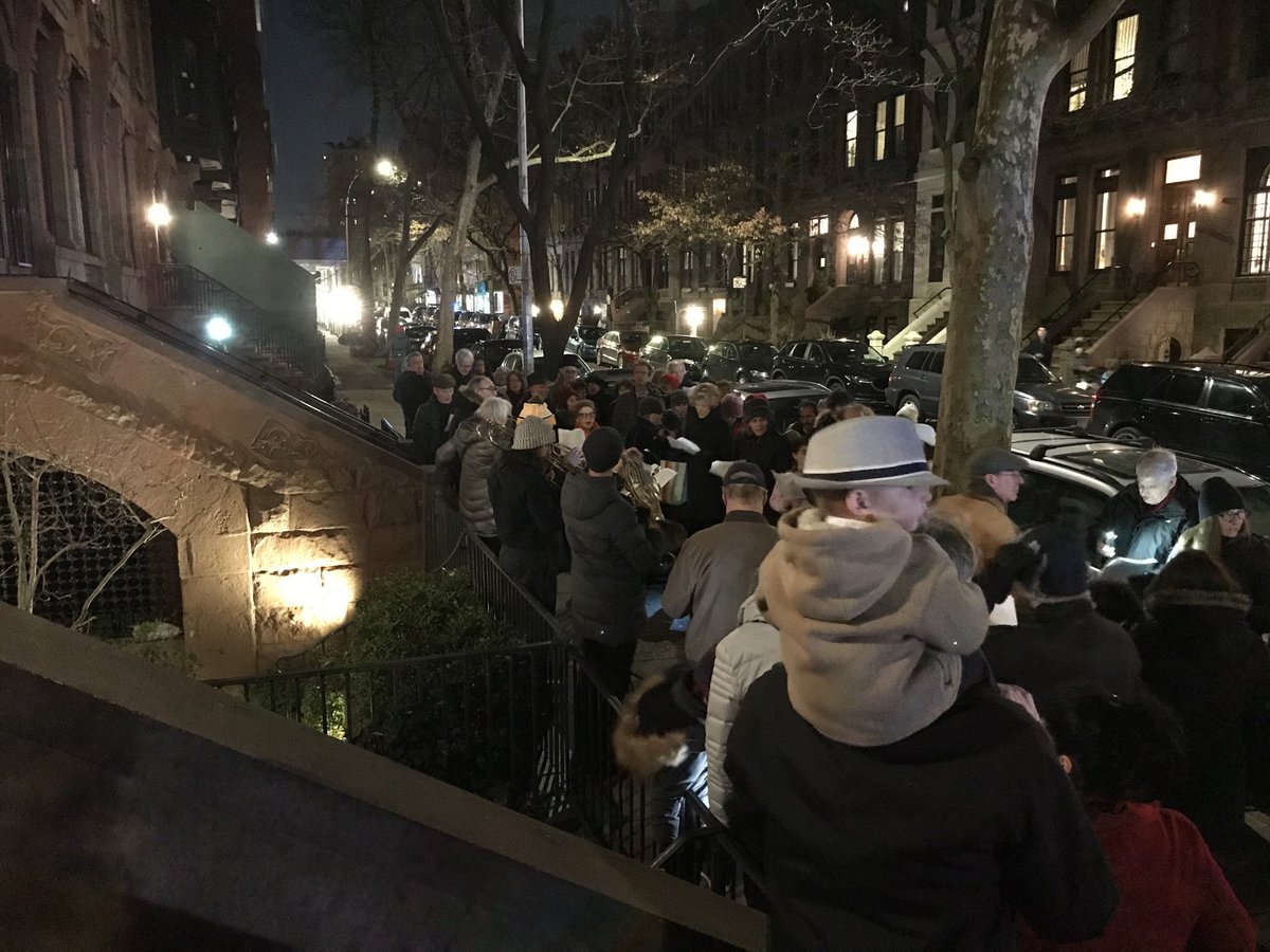 Betsywest's tweet photo. Update from West 87th Street: Xmas caroling crowd is growing. https://t.co/oMMOLXVEnh