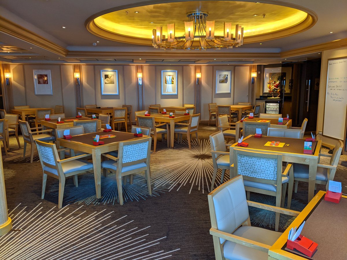 BridgeMojo's tweet image. The Bridge Lounge on the Crystal Symphony, between games. 15 tables available. Eight table game today.