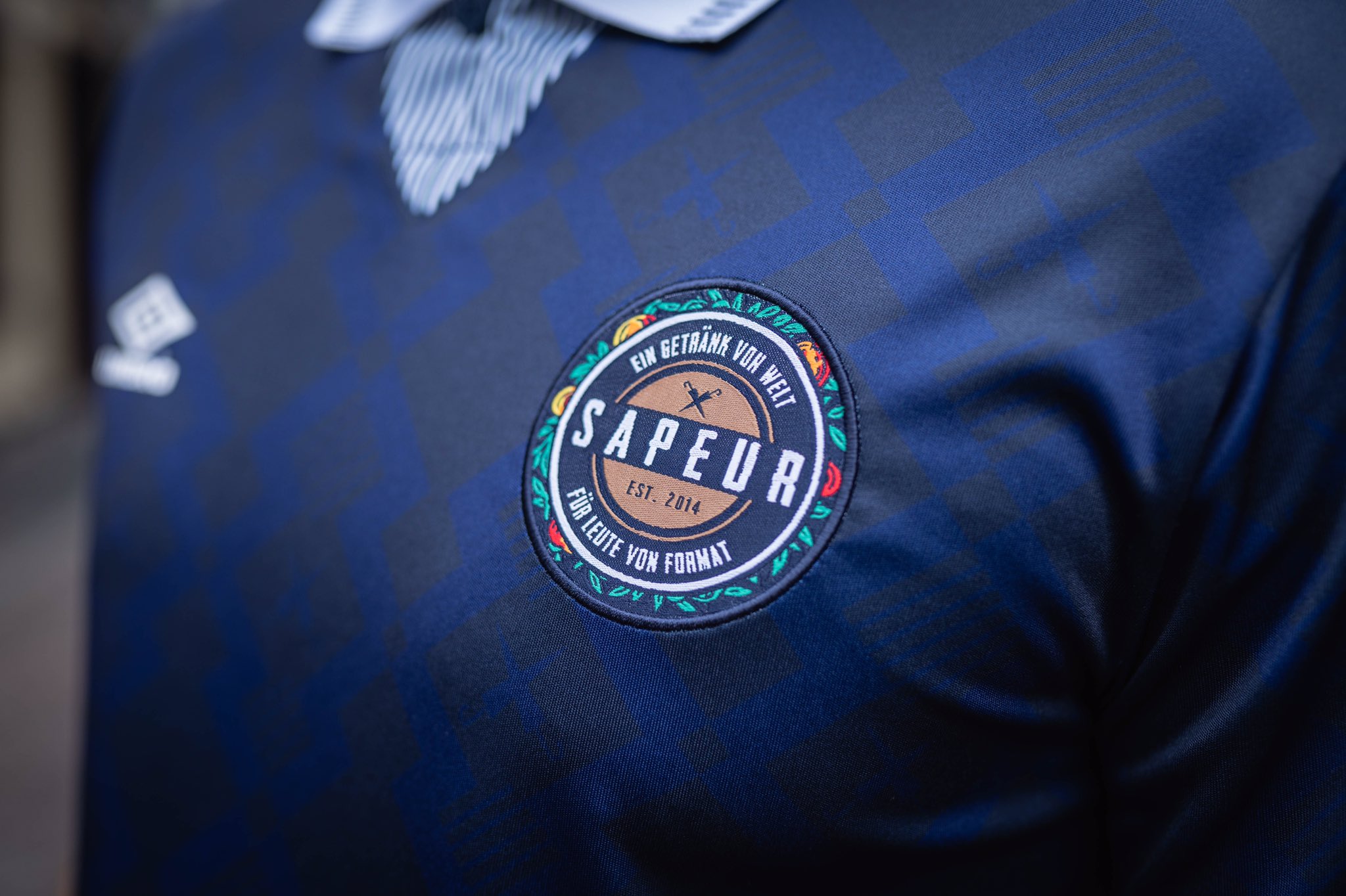 Umbro on Twitter: "Umbro x Sapeur revives and celebrates the spirit of a  special area in football culture, Frankfurt's favourite beverage and the  Sapeur blog that unites both through two archive inspired
