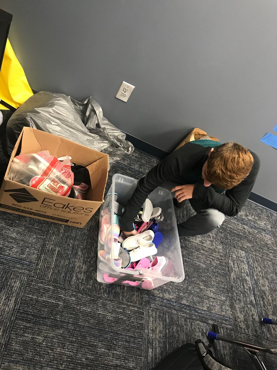 Counting the shoes we received for our SHOE DRIVE! Thank you to everyone who donated.