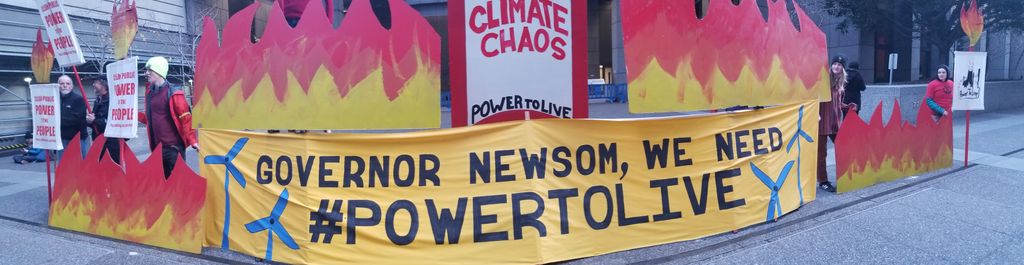 MaskOakland's tweet photo. BREAKING: Activists have LOCKED DOWN all entrances to PG&amp;E headquarters in San Francisco to demand they give back their profits until safe, that @GavinNewsom must hold killers accountable and protect vulnerable communities. #PGEisKillingUS #PowerToLive https://t.co/7LOsldo5fS