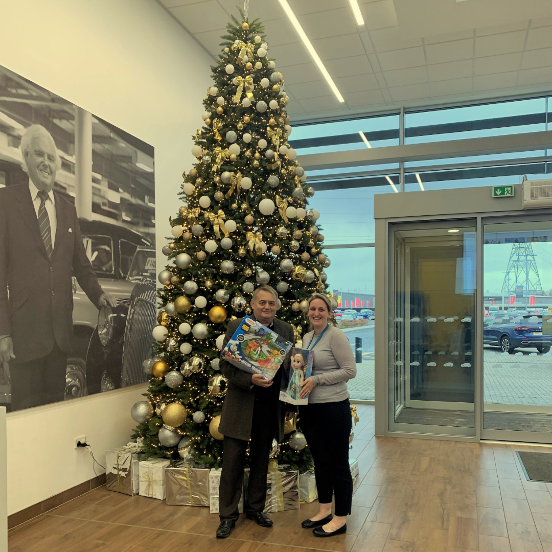 Stuart Williamson from Tara Signs and Nicola Coutts from Arnold Clark group estates at Hillington with some of the donations to the Arnold Clark Christmas toy charity appeal for disadvantage children.  #tarasigns