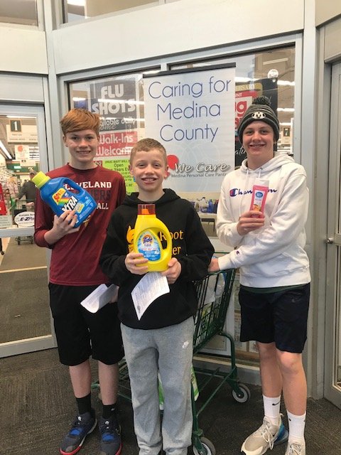 AI Root basketball team received $1000 in donations for Medina Care Pantry! Serving other this Christmas.