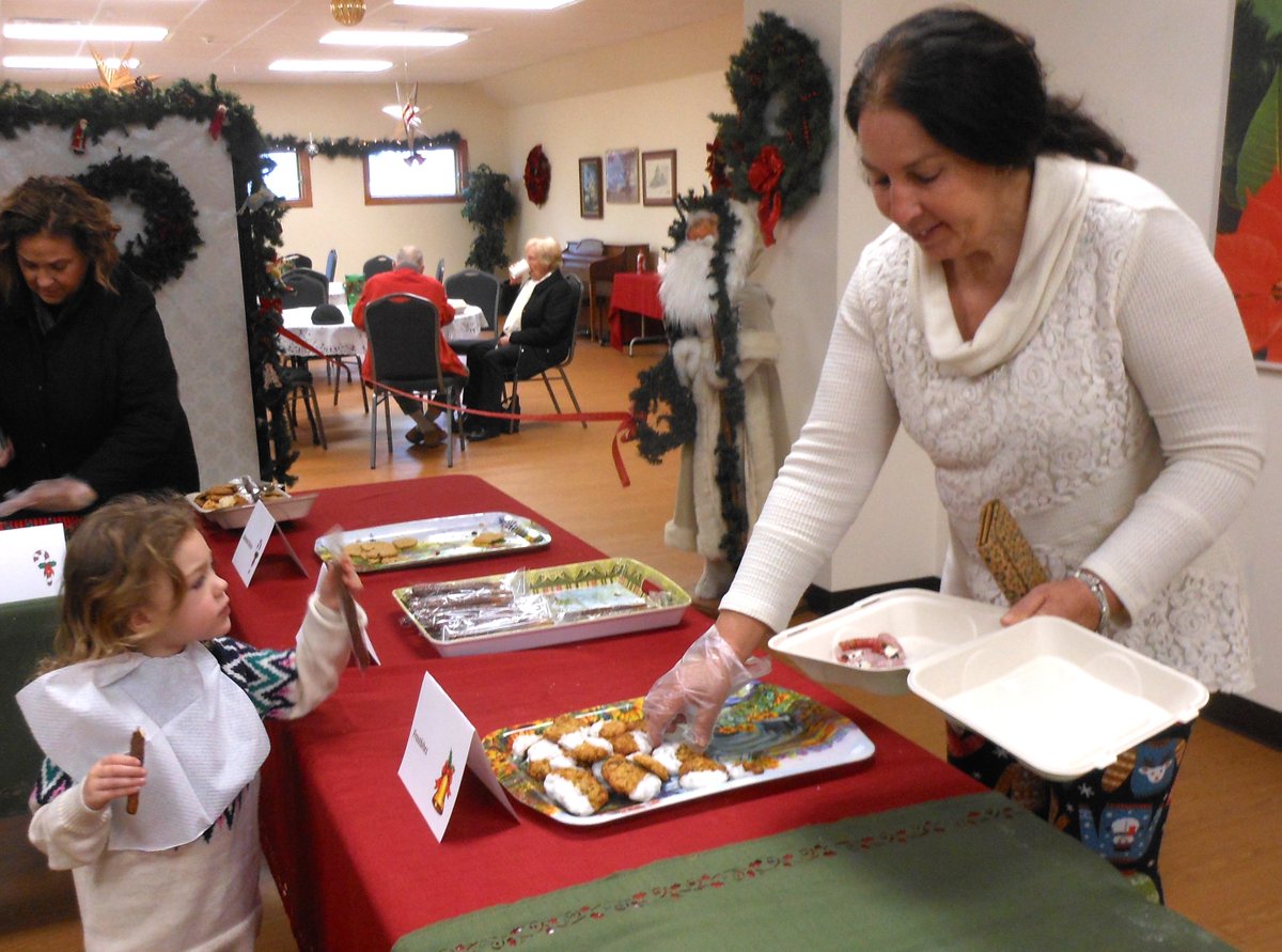 COOKIE WALK -The 19th annual Cookie Walk at 1st Presbyterian Church Hawley was a sweet success.  Jane Bozan of Beach Lake, picks out some cookies with help from granddaughter Olivia. See Tuesday's Tri-County Independent for more Hawley Winterfest photos.
TCI photo by Peter Becker