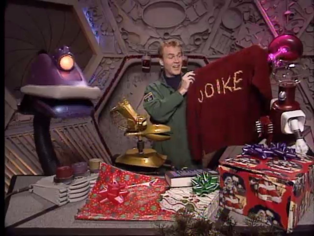 ChristessaC's tweet photo. You know you’re a MSTie when you see the side view of a coworker wearing a red sweatshirt with gold letters “-IKE” &amp; your 1st thought is “My new best friend‼️” I was so disappointed when she faced me &amp; it said NIKE. 😞 #mst3k #JOIKE https://t.co/Sv16XsNE1Q