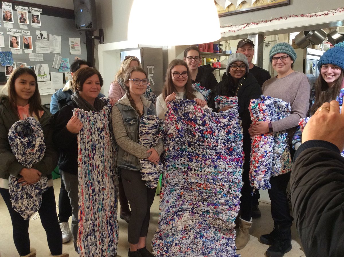 BowmanvilleHS's tweet photo. The second stop for #communitykindness day was at #TheRefugeOshawa. This group of ⁦@BowmanvilleHS⁩ have been crocheting and weaving #milkbagmats since September. Today we dropped off 13 sleeping mats just in time for the holidays!  #helpinghomelessyouth  #KPRconnects https://t.co/V8D8dcALH2