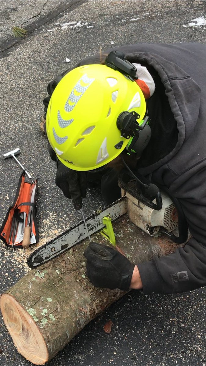 Field sharpening the Stihl before conquering a pine in #milfordnh today... Bitter cold start but the team crushed it! 😎🌲👍