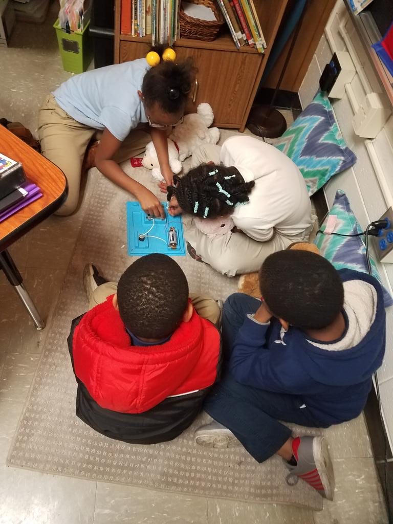 Mrs. Megargel's and Mrs. Tucker's students collaborating to discover ways to start a motor using a circuit system. <a href="/PriceOwls/">Price Elementary</a>