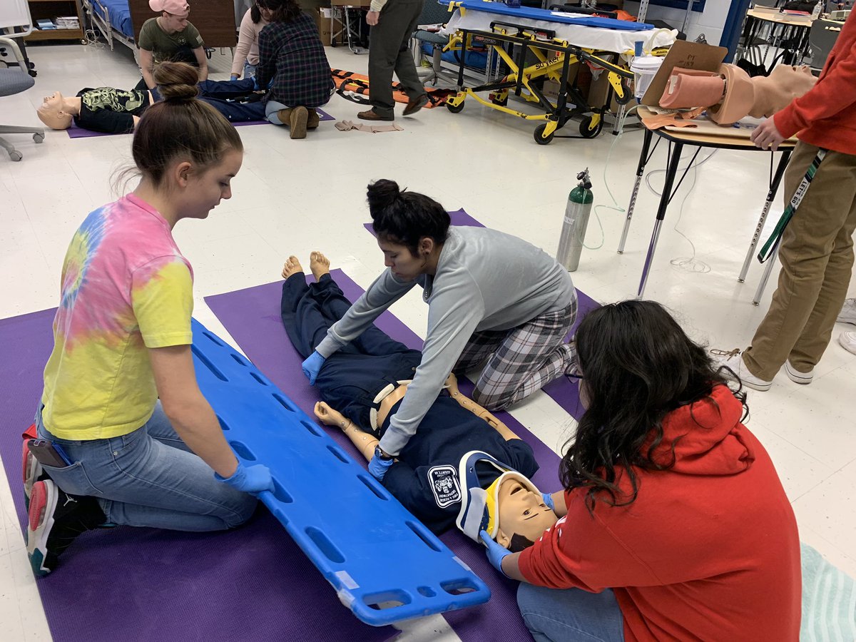 EMT practices Spinal immobilization.