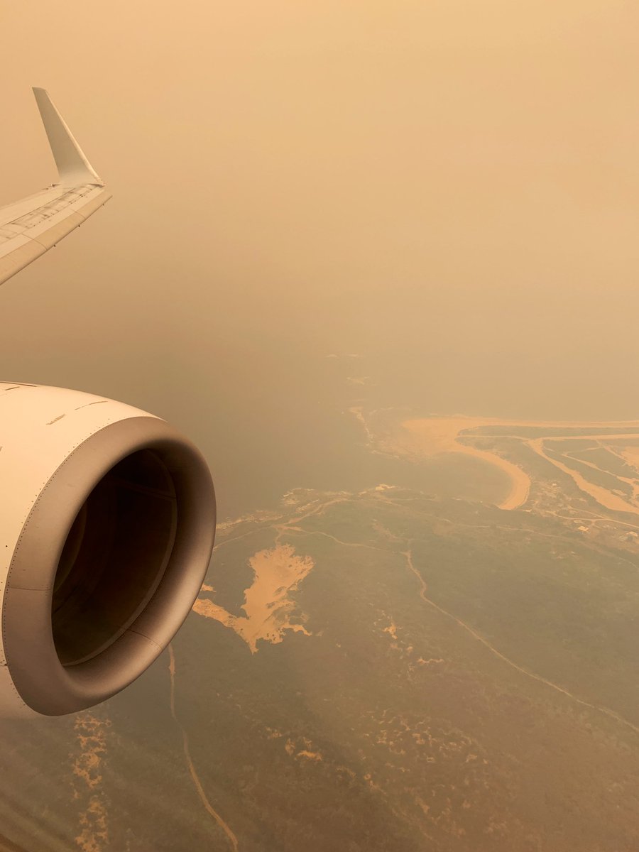 View of Sydney’s Botany Bay from the sky with severe pollution causing orange haze and low visibility