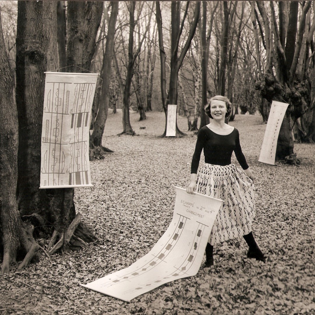 LanguageofDance's tweet image. #TBT 1957 - We love this image on Ann, our founder, in Epping Forest surrounded by notation and wearing her famous notation skirt! #dancenotation #labanotation #annhutchinsonguest #eppingforest #1957
