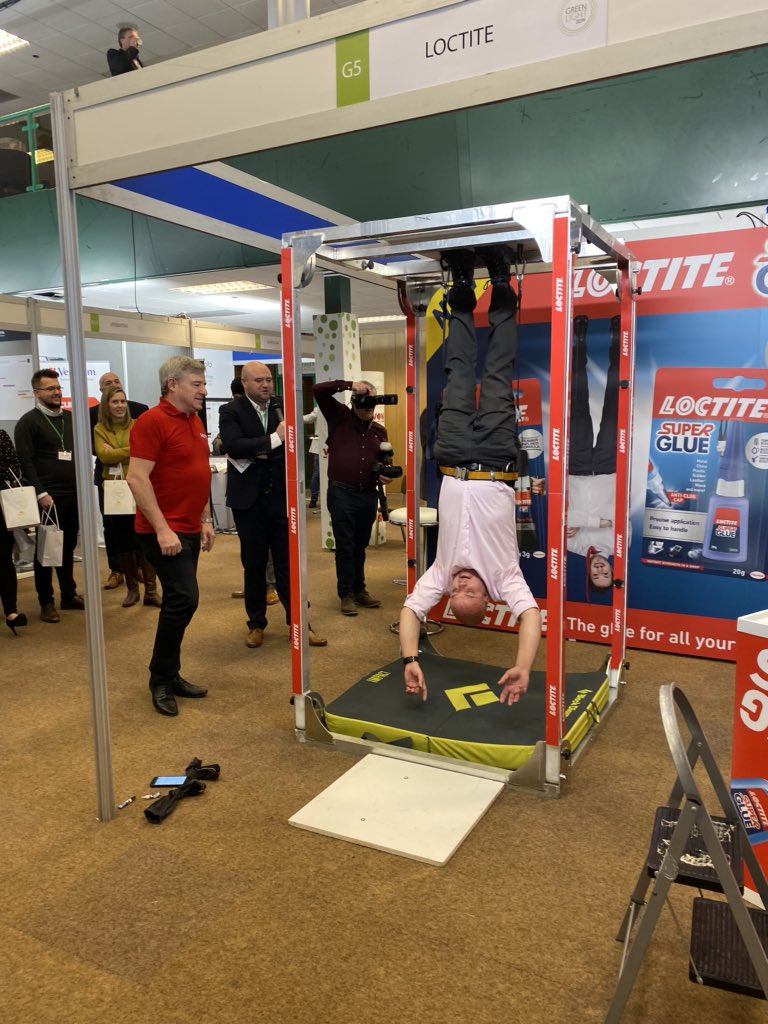 What a great way to start the day! Our very own Chris Ellis being hung upside down on @HenkelUK #Loctite #hangingman. Make sure you don’t miss the next one at 11.15am! #greenlight2019