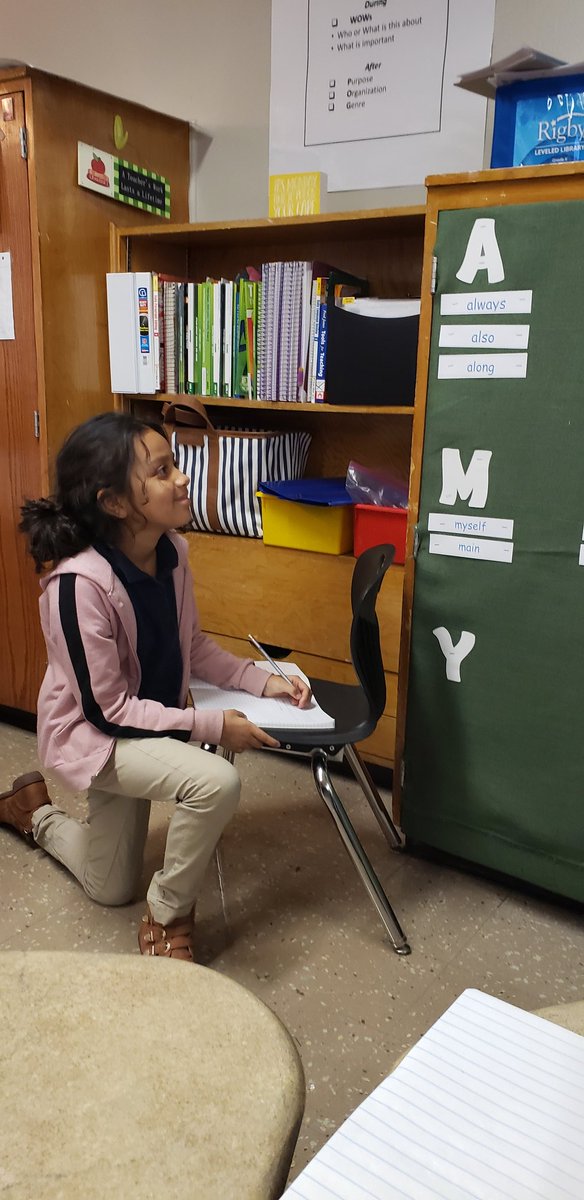 Utilizing the word wall to finish her persuasive letter! <a href="/OakSpringsElem/">Oak Springs</a> #dolphinstrong
