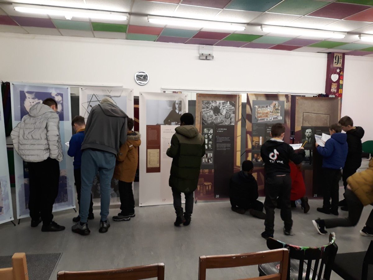 AnneFrankTrust's tweet photo. This week weโve had the joy of working with @LeverParkSchool. We trained 6 of their y11 students as peer guides. Here they are helping primary children to complete an exhibition trail after giving them a very knowledgeable tour. A brilliant project! Thanks @bolton_pru! https://t.co/QnsTa3qFPP