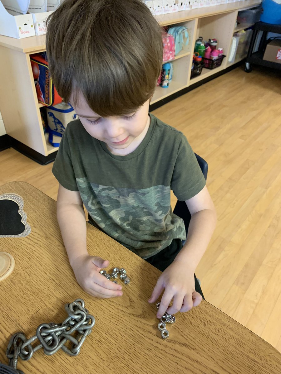 kindiegators's tweet photo. We’re tinkering today! Exploring ways to use nuts, bolts, washers and chain links. #finemotorskills #realmaterials #looseparts #ticker #problemsolving #innovation #STEM https://t.co/LKcUguCR8o