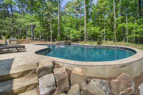 BlueHavenPoolNC's tweet image. This #freeformpool &amp;amp; attached spa take advantage of the property's naturally sloping yard by utilizing the pool as a retaining wall. In doing so, we were able to include an #outdoorkitchen and grill area in the design that helps give this property a simple yet #charming appeal.