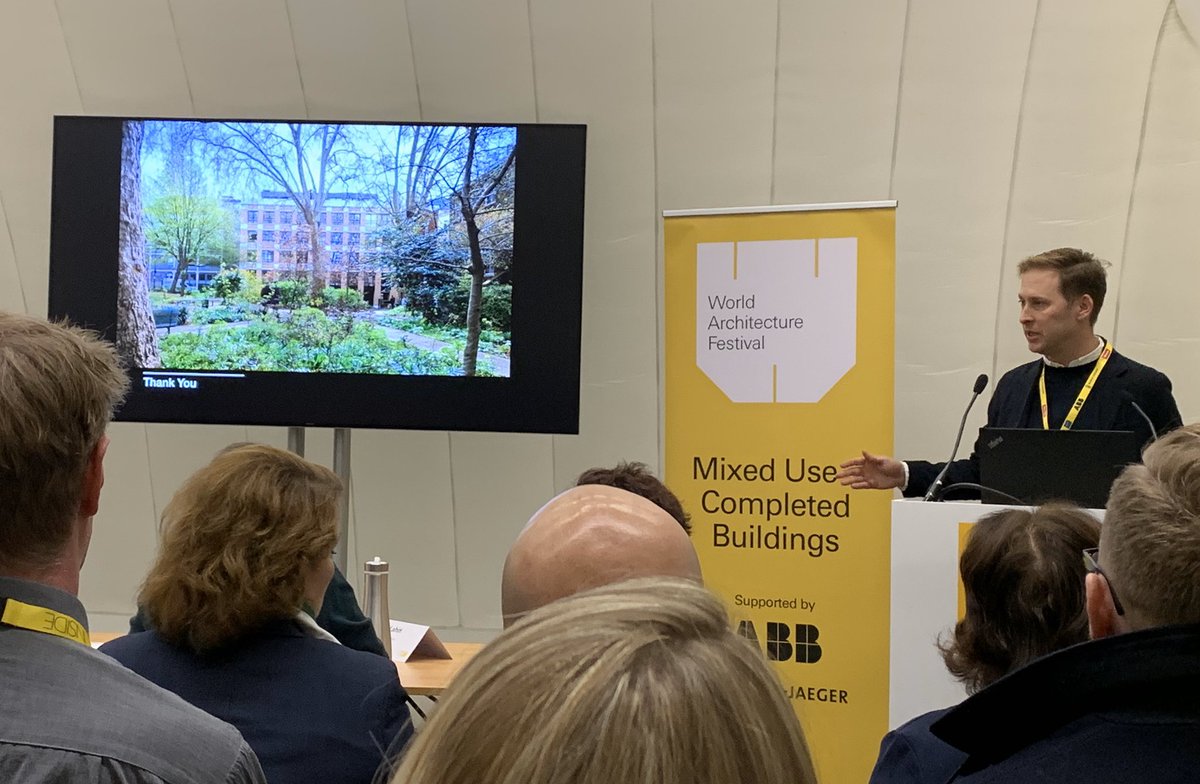 AHMMArchitects's tweet photo. Philip Turner presents Benjamin Street for the Completed Buildings: Mixed Use award at day 2 of @worldarchfest #WAF19 https://t.co/lyz0YMzVbH