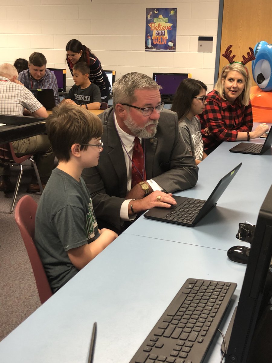 AngletonISD's tweet photo. County Judge @MattSebesta is here completing his #HourOfCode with Andrew providing backup! https://t.co/i88slozMH9