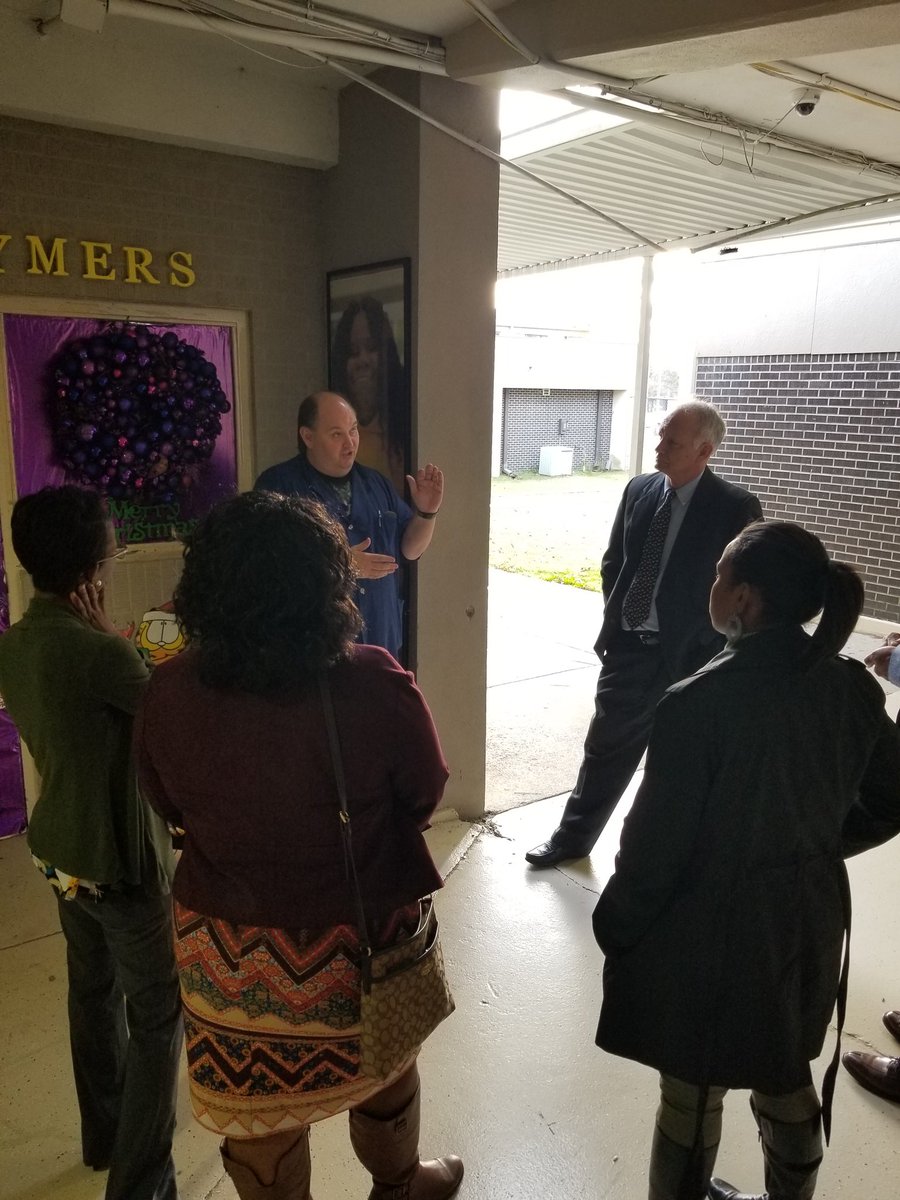 HPSD Board members made a visit to HHS and is talking to HHS teacher of the year James Brownlow.