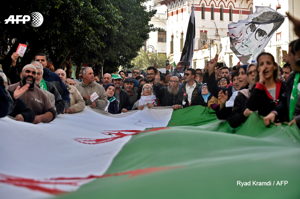 AFP's tweet photo. From Algeria to Hong Kong, angry citizens have swelled streets across the globe in #2019, pushing back against a disparate range of policies but often expressing a common grievance -- the establishment's failure to heed demands for a more equitable future https://t.co/sJSF0YlKJQ https://t.co/LKuJA61u5x