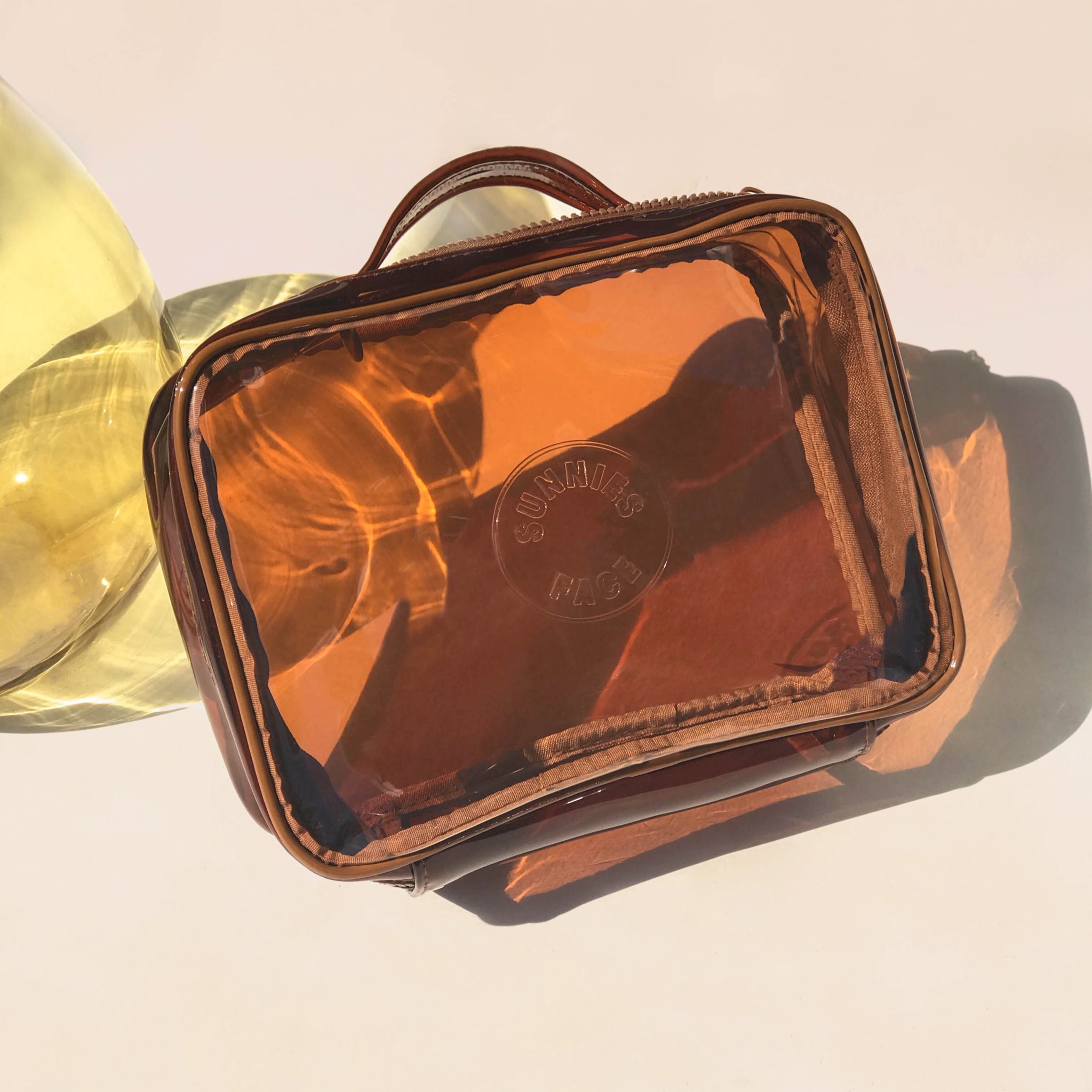 sunnies face on X never leave anything behind imagine a weekend bag that carries all your travel makeup essentials in one go we designed the weekend jelly bag to