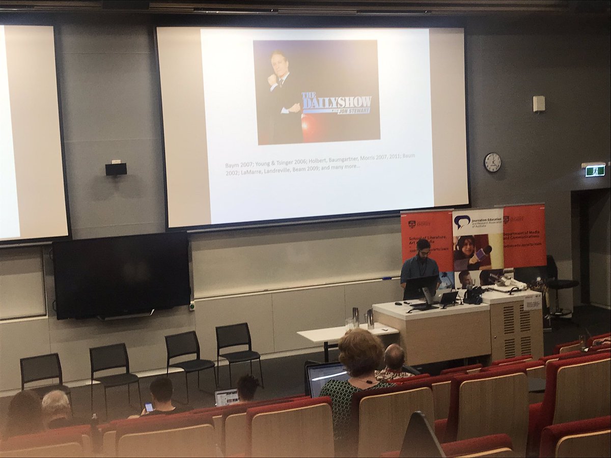JERAA2019's tweet photo. Cale Bain from UTS is talking about comedy journalists and their news values with the contrast of traditional journalists. #jeraa19 https://t.co/XoLdwlWicV