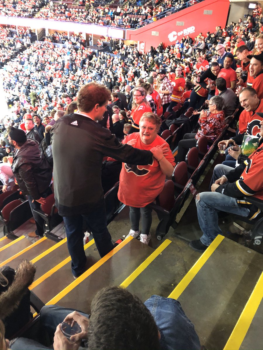 macgolfy's tweet photo. @NHLFlames @ShaganappiGm This nice lady was two seats away from me. This is what it looks like when you win a new car. https://t.co/asaSSC6nDe