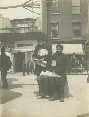 Blind news vendor standing at corner of New Street and Worcester Street, #Birmingham, May 1900. A note on the back of the photograph states that the buildings depicted were moved to make way for the new Midland Arcade. [WK/B11/386] # Archives PhotoFriday