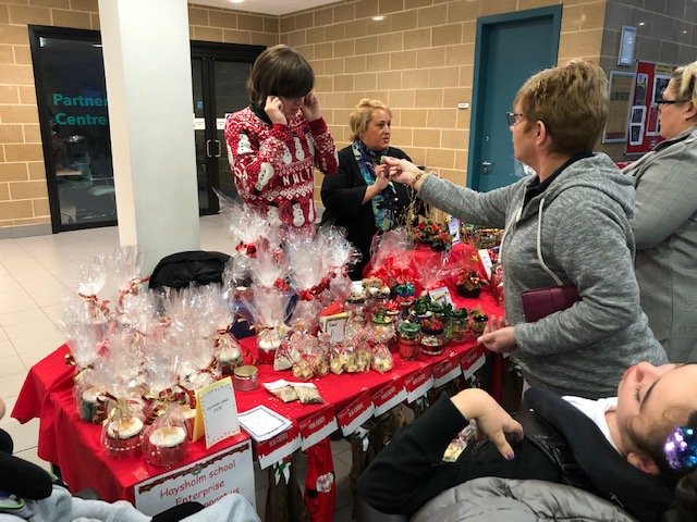 ESKilwinning's tweet photo. Students and staff from @haysholm_school had a great time today @AyrshireColl selling fantastic handmade #Christmas goodies created by the school’s pupils.  Joe and Gary helped take cash and hand out change. They made a big impression on all who met them 🎅🌲🦌 #tistheseason https://t.co/kNhfGgqj9c