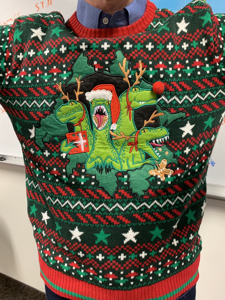 Not everyone’s Christmas sweater is a personalized family photo! 🦖