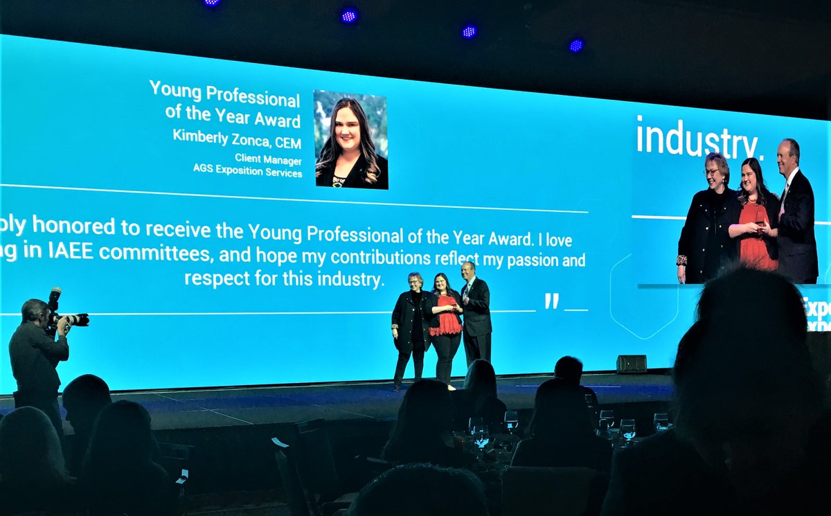 AGSExpoServices's tweet photo. We are so proud of our very own Kim Zonca for receiving the @IAEE_HQ Young Professional of the Year Award! 😍
#WeLoveOurTeam #expoexpo #iaee #iaeeyp #ypoftheyear #youngprofessional #tradeshowlife https://t.co/e443NIWbNu