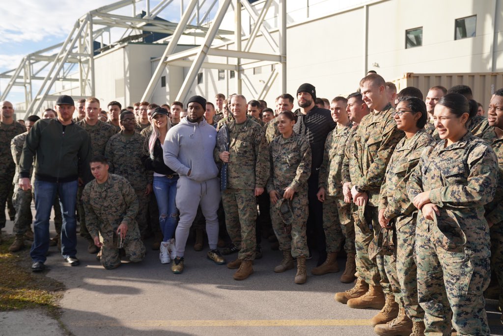 WWE's tweet photo. Before tonight’s episode of #SmackDown, @WWERomanReigns, @DanaBrookeWWE, @WWEBigE, @TrueKofi &amp; @HeathSlaterOMRB visited @Camp_Lejeune and took part in some @USMC activities! #Troops @MCASNewRiver @DeptofDefense https://t.co/TXsAPnuMnG