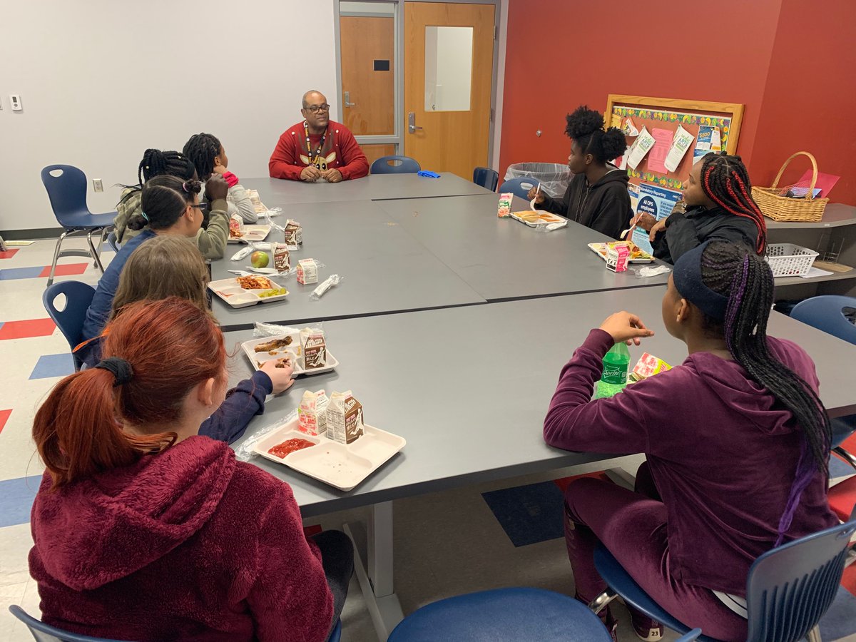 Young ladies lunch bunch meeting with Principal Williams to discuss things going on around Nathan Hale