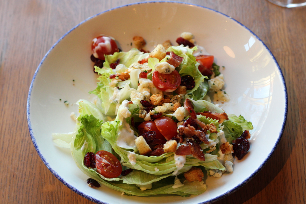 The Emporium Wedge Salad features @riverbearamericanmeats bacon, house bleu cheese vinaigrette, house champagne vinaigrette, dried cranberries, and house croutons. Should I say house again? Fine, house. The salad is delicious!

#emporiumkitchenandwinemarket #emporiumfortcollins