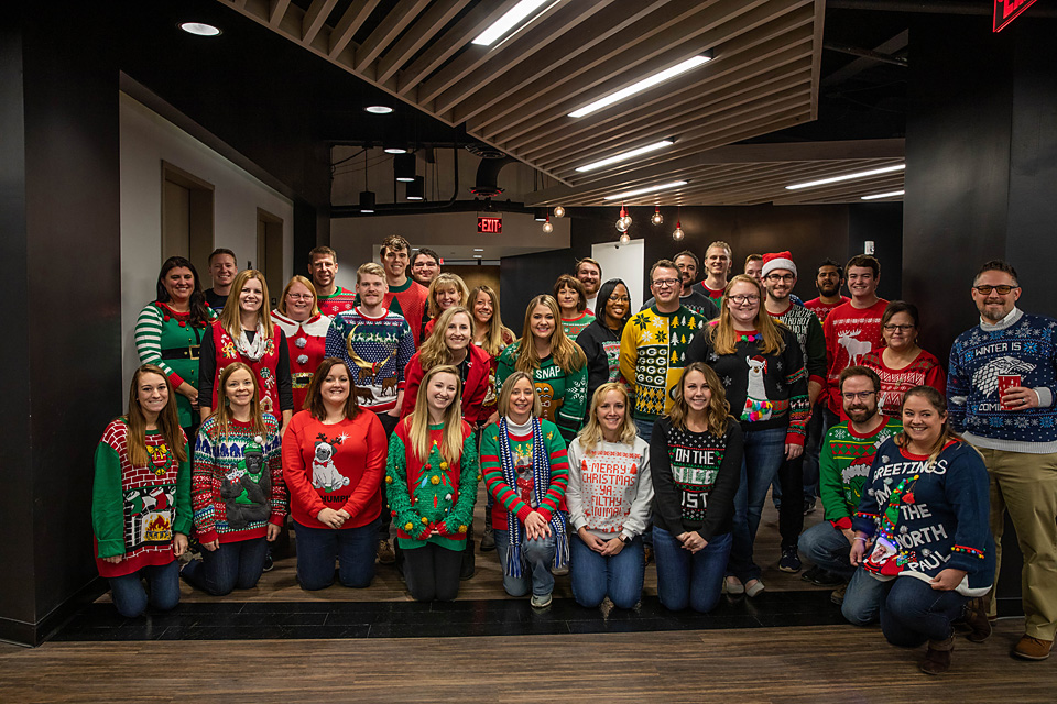 AmericanStrpnt's tweet photo. Tis the season for festive Fridays! Check out some of our Indy staff sporting their best ugly sweaters – which is your favorite? https://t.co/5i2MsH8c6N