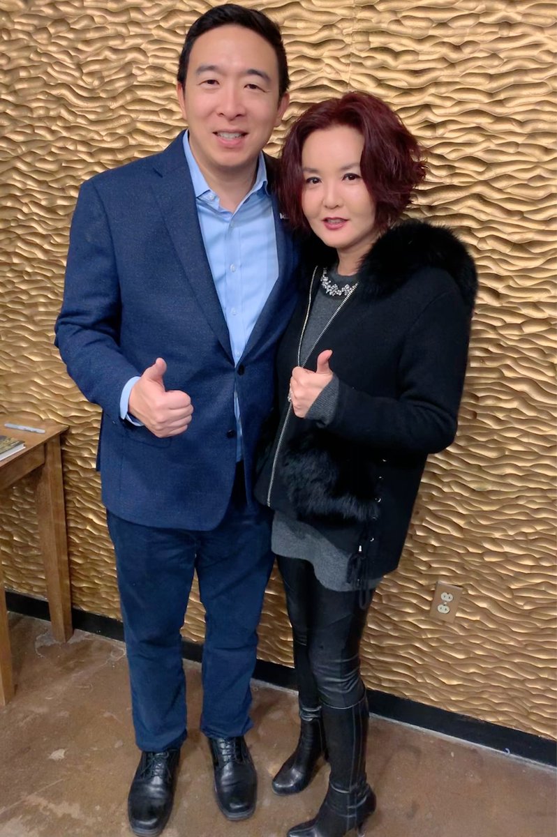 WomenLeisure's tweet photo. So much fun at @DFWforYang meeting AY. Over 1000+ showed up! My two Asian men.😍😍 Photobombed one. His speech was a little different than what I heard before. This room is for high donors. Those of us who paid $1000+ got signed book plus pics with him. #YangGang #YangInDallas https://t.co/TaJfurkOfD