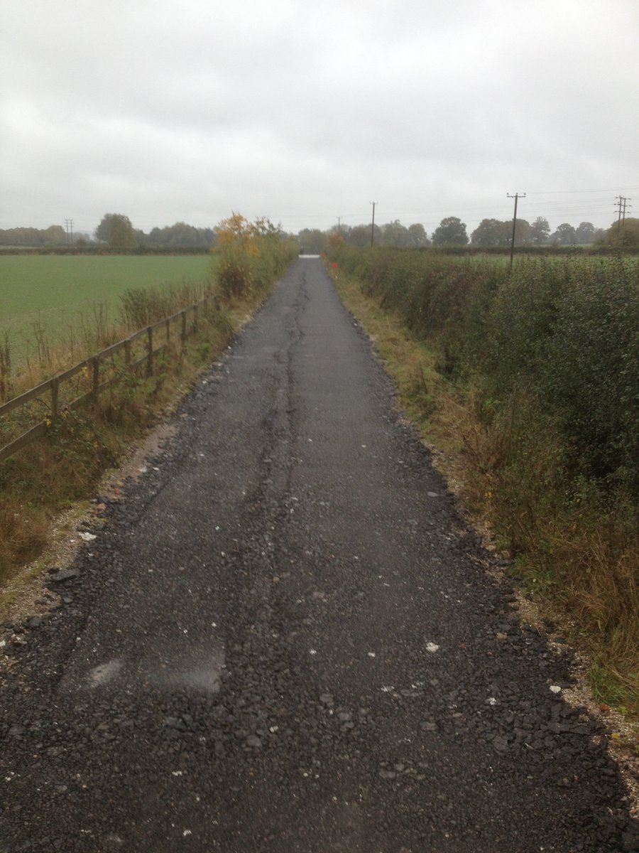 ODrewitt's tweet photo. farm track from 5 years ago needed a little attention, 480t pulled out, 150mm of type 1 and capped with 100mm of planings from the M4 motoway. #farmtracks #takeuchi #roadplanings #groundworks https://t.co/OW4MbVU3g7